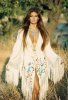 Raquel Welch young 70s white open dress deep cleavage.jpeg